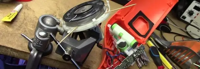 Vacuum cleaner repair parts and tools on a workbench in Cincinnati, OH
